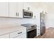 Close up of the kitchen with stainless steel oven, cook top, and microwave at 13650 Sw 43Rd Cir, Ocala, FL 34473