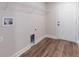 Convenient laundry room with sleek flooring and ample space for appliances at 13650 Sw 43Rd Cir, Ocala, FL 34473
