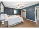 Comfortable bedroom showcasing wood floors, a queen bed, and a closet at 1504 Glendale St, Lakeland, FL 33803