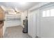 Spacious storage area with built-in shelving, a water heater, and ample room for organization at 1504 Glendale St, Lakeland, FL 33803