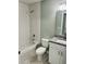 Bathroom featuring a white subway tile shower and granite-topped vanity at 1522 Kettles Ave, Lakeland, FL 33805