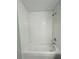 White subway tiled shower with a standard shower head and chrome finishings at 1522 Kettles Ave, Lakeland, FL 33805