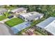 Charming home with a long driveway and lush green lawn, surrounded by mature trees and landscaping at 1610 Reynolds Rd # 50, Lakeland, FL 33801