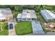 Beautiful home with well-manicured lawn, long driveway, and verdant landscaping from an aerial perspective at 1610 Reynolds Rd # 50, Lakeland, FL 33801