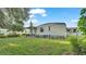 Home boasts a spacious backyard with a covered patio, perfect for enjoying outdoor relaxation and dining at 1610 Reynolds Rd # 50, Lakeland, FL 33801