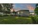 Relaxing backyard featuring lush green grass and a cozy patio, perfect for outdoor enjoyment at 1610 Reynolds Rd # 50, Lakeland, FL 33801