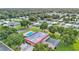 Aerial view highlighting a pool, clubhouse, and green spaces within a quiet residential community at 1610 Reynolds Rd # 50, Lakeland, FL 33801