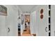 Bright hallway with wood floors leads to various rooms in this cozy home at 1610 Reynolds Rd # 50, Lakeland, FL 33801