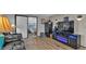 Stylish living room showcasing the entertainment center, seating area and seamless access to the bedroom at 1610 Reynolds Rd # 50, Lakeland, FL 33801