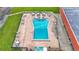 Stunning aerial view of a community pool, with a brick-paved sundeck and comfortable lounge chairs at 1610 Reynolds Rd # 50, Lakeland, FL 33801