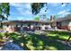 Large backyard featuring a patio and lush lawn at 1655 John Arthur Way, Lakeland, FL 33803