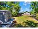 Large backyard with a shed and well-maintained lawn, perfect for outdoor activities and storage at 1655 John Arthur Way, Lakeland, FL 33803