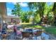 Beautiful backyard with mature trees, play set, and patio area at 1655 John Arthur Way, Lakeland, FL 33803