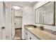 Nicely appointed bathroom with granite countertop vanity and view to open closet at 1655 John Arthur Way, Lakeland, FL 33803