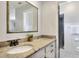 Nicely appointed bathroom with granite countertop vanity and view to shower at 1655 John Arthur Way, Lakeland, FL 33803