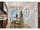 Dining area with large wall clock and tiled floors at 1655 John Arthur Way, Lakeland, FL 33803