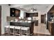 Eat-in kitchen with dark wood cabinets and granite countertops at 1655 John Arthur Way, Lakeland, FL 33803