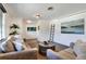 Relaxing living room featuring wood floors, neutral furnishings, and stylish decor, ideal for Gathering and guests at 1655 John Arthur Way, Lakeland, FL 33803