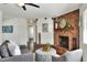 Cozy living room featuring a brick fireplace and stylish decor at 1655 John Arthur Way, Lakeland, FL 33803
