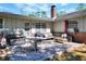 Inviting patio features brick pavers, comfortable seating, and a built-in grill for outdoor entertaining at 1655 John Arthur Way, Lakeland, FL 33803