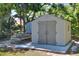 Durable backyard storage shed on a concrete slab providing ample space for tools and equipment at 1655 John Arthur Way, Lakeland, FL 33803