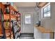 Storage room with wood shelves and workbench at 1655 John Arthur Way, Lakeland, FL 33803
