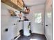Utility room featuring shelving and access door at 1655 John Arthur Way, Lakeland, FL 33803