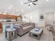 Bright open-concept living space with barstool seating, opening up into a spacious kitchen at 1757 Burrows Ave, Lakeland, FL 33811