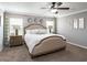 Serene main bedroom featuring a comfortable king-size bed, soft lighting, and stylish decor at 1757 Burrows Ave, Lakeland, FL 33811