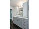 Bathroom featuring gray vanity, white vessel sink, granite countertop, and modern lighting at 1931 Matthew Ct, Lakeland, FL 33813