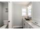 Well-lit bathroom with a vessel sink, granite countertop, and a modern toilet in a cleanly designed space at 1931 Matthew Ct, Lakeland, FL 33813
