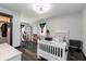 Comfortable bedroom features a white bed and dresser, with a walk-in closet and ample space for play at 1931 Matthew Ct, Lakeland, FL 33813