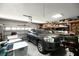 Spacious garage with organized storage shelves and an automatic door opener, offering secure parking at 1931 Matthew Ct, Lakeland, FL 33813
