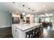 Bright kitchen with a large island, stainless appliances, and an open view to the dining area at 1931 Matthew Ct, Lakeland, FL 33813