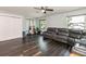 Spacious living room with a reclining sofa and home gym, offering comfort and fitness in a single room at 1931 Matthew Ct, Lakeland, FL 33813