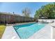 Backyard pool with patio, and lush garden providing a private outdoor oasis at 1931 Matthew Ct, Lakeland, FL 33813