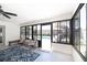 Spacious sunroom with access to pool area, ceiling fan, and two swivel chairs at 1931 Matthew Ct, Lakeland, FL 33813