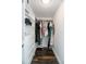 Bright walk-in closet boasts custom shelves, drawers, and hanging rods, optimizing storage space at 1931 Matthew Ct, Lakeland, FL 33813