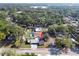 Aerial view of the property showcasing the home, surrounding trees, yard, and neighborhood at 2104 W End Ave, Lakeland, FL 33803