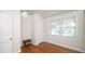 Cozy bedroom features hardwood flooring, closet, and a bright window at 2104 W End Ave, Lakeland, FL 33803