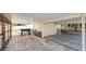 Large carport with stone pavers and wood storage, leading to outdoor living space at 2104 W End Ave, Lakeland, FL 33803