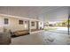 Spacious carport area featuring an attached shed and wooden porch at 2104 W End Ave, Lakeland, FL 33803