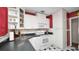 Cozy kitchen with white cabinetry, black countertops, and a black and white checkered tile floor at 2104 W End Ave, Lakeland, FL 33803