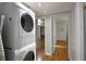 Convenient interior laundry area featuring a stacked washer and dryer at 2104 W End Ave, Lakeland, FL 33803