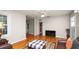 Bright living room featuring hardwood floors, a ceiling fan, and an open layout with ample space at 2104 W End Ave, Lakeland, FL 33803