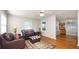Cozy living room offering hardwood floors, large windows, and a seating area with an ottoman at 2104 W End Ave, Lakeland, FL 33803