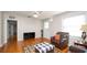 Inviting living room featuring gleaming hardwood floors, abundant natural light, and a cozy seating area at 2104 W End Ave, Lakeland, FL 33803