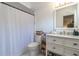 Bathroom with white vanity, shower curtain, and a toilet at 221 Stevenson Rd, Winter Haven, FL 33884
