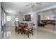 Bright dining room with seating for six and view to living room at 221 Stevenson Rd, Winter Haven, FL 33884