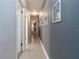 Hallway with gray walls, white trim, and tile flooring at 221 Stevenson Rd, Winter Haven, FL 33884